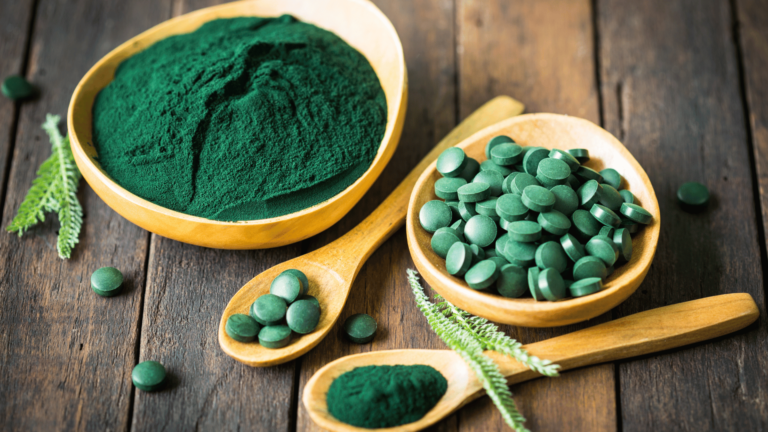 A spoonful of spirulina powder and tablets