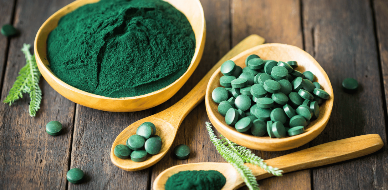 A spoonful of spirulina powder and tablets